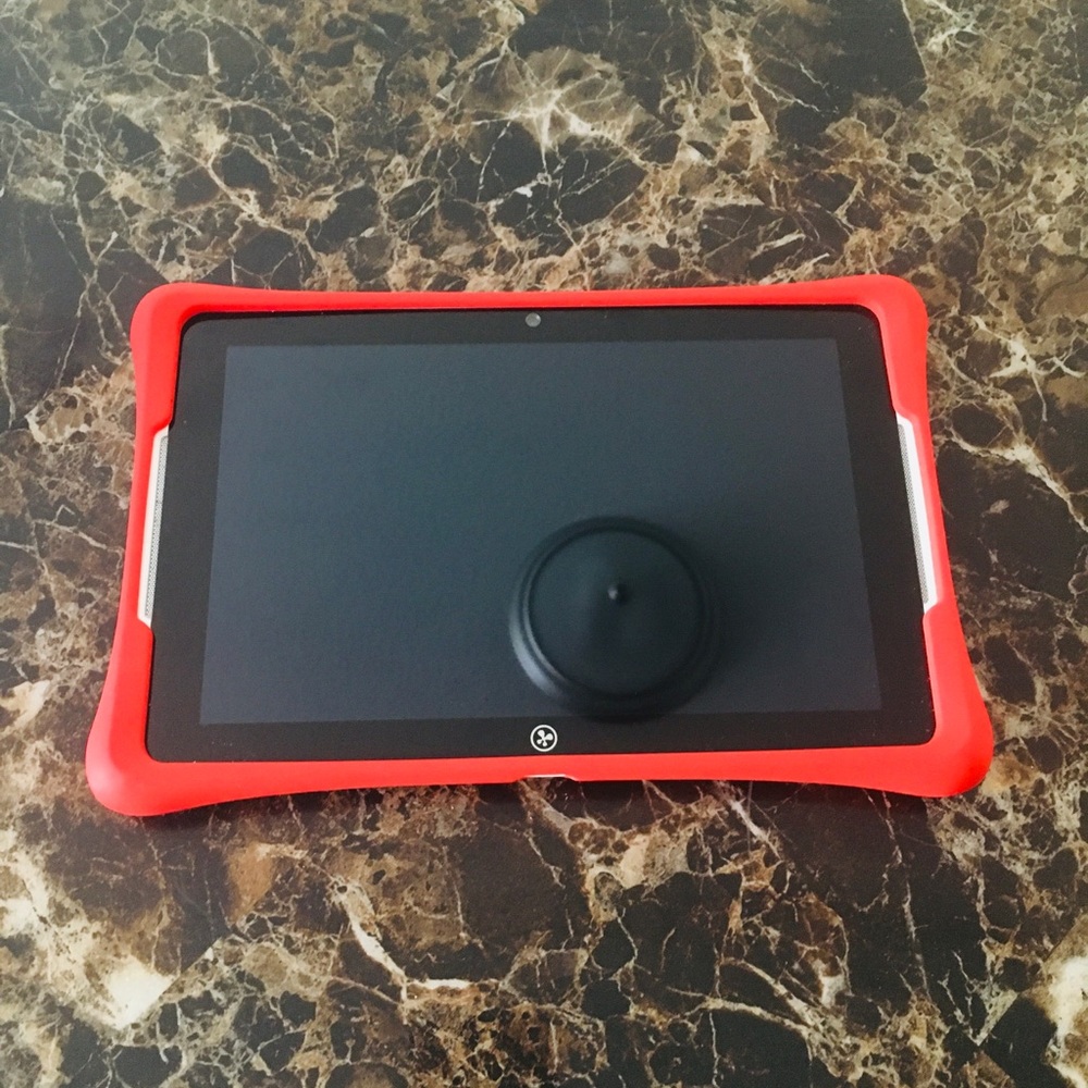MINI WHITE TABLET WITH RED PROTECTOR AND A CHARGER